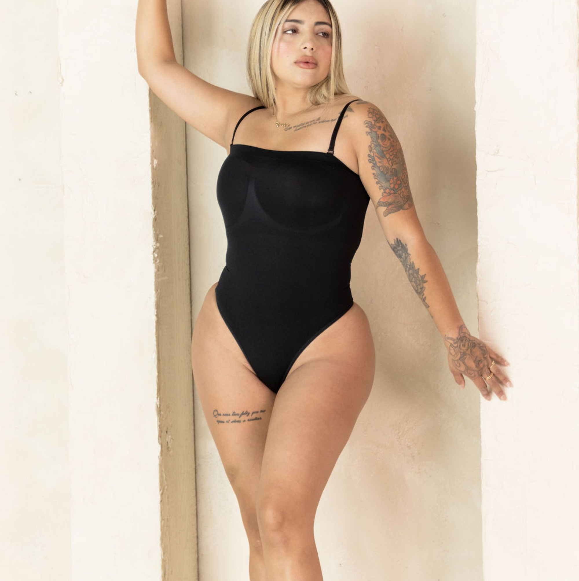 Detachable straps, black body shape wear, thong.